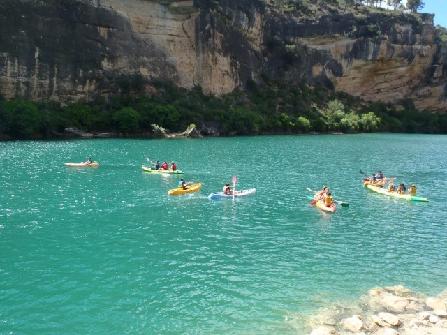  Beautiful landscape with our canoes and clients in the sea 